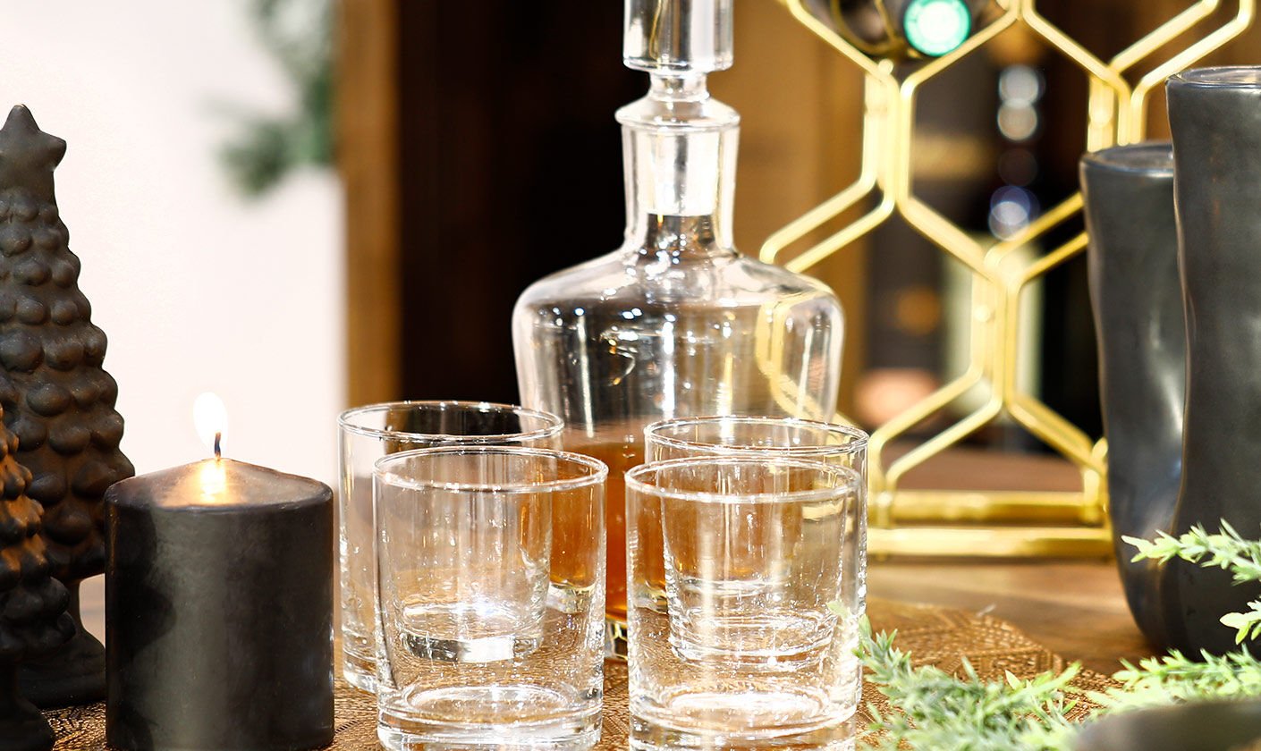 An assortment of elegant dinnerware including plates, bowls, and utensils.